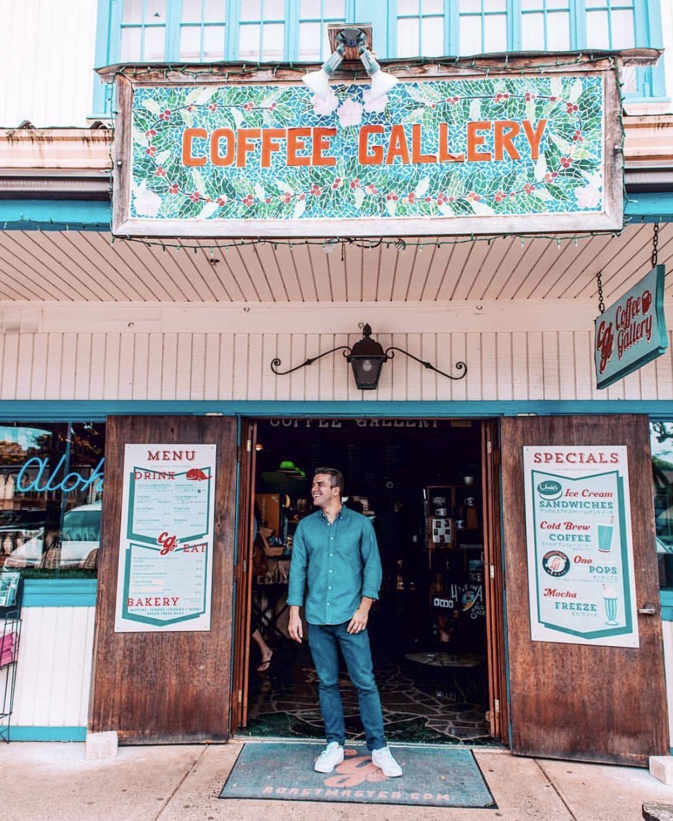 A man standing in the doorway of The Coffee Gallery cafe